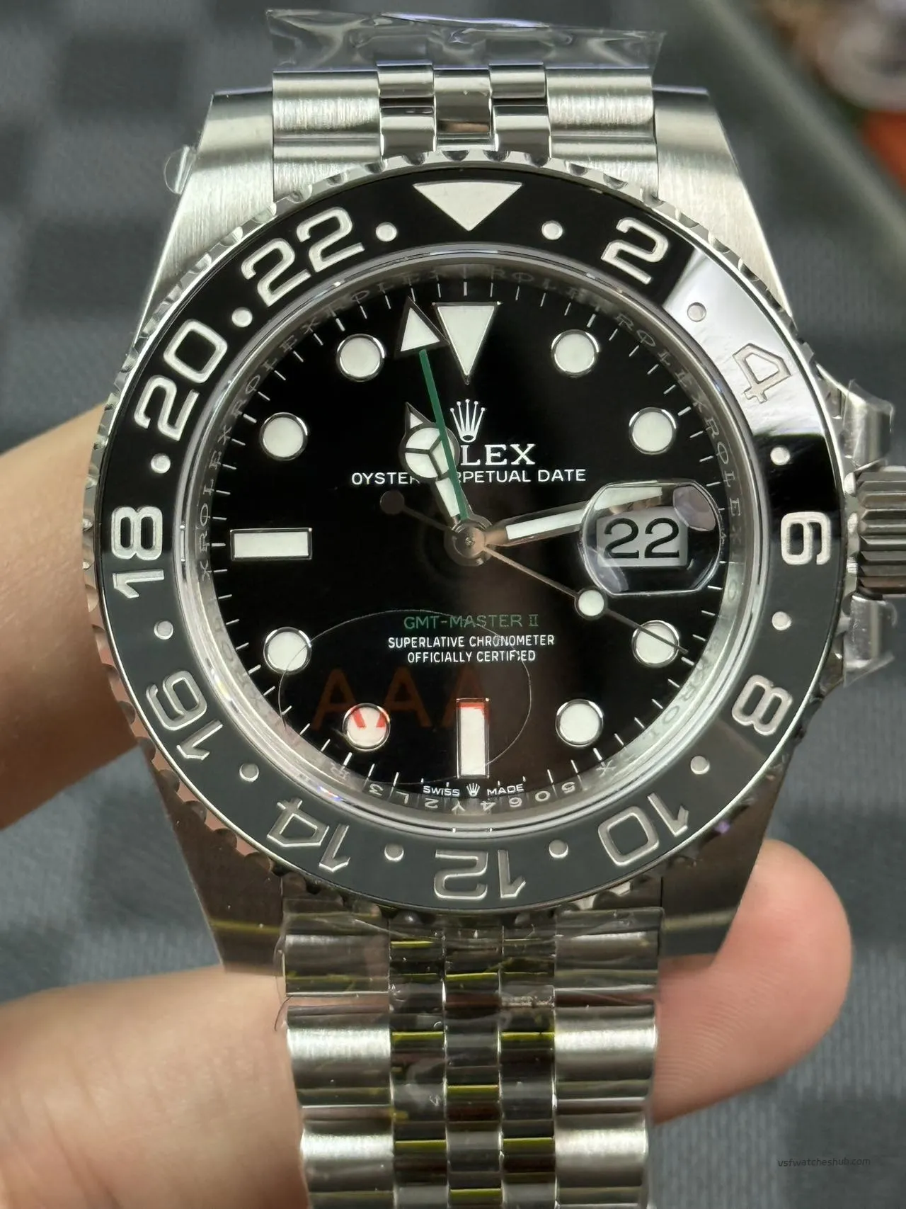 VSF GMT-Master II 126710GRNR dial close-up grey black ceramic bezel green GMT hand